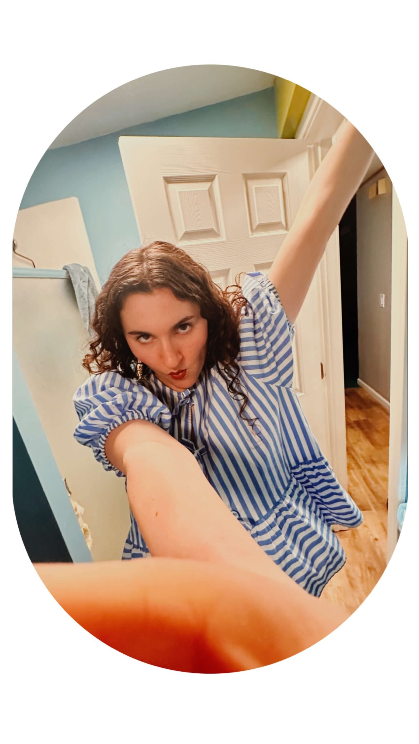 Outtake No. 3 from Attalie Anne's Sardines Song album cover photo shoot. A silly selfie of Attalie in a nautical stripe blouse